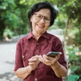 Older female adult using her smartphone