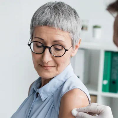 Adult woman receiving a flu vaccine
